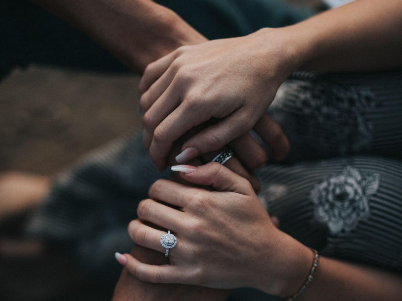 man and woman holding each others hands